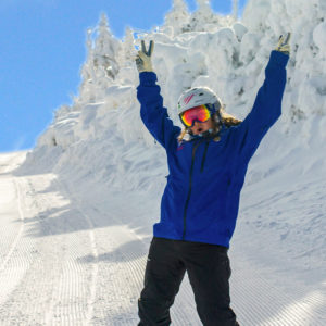 Sugarbush employee skiing showing peace sign